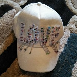 White hat with the word love in sequence